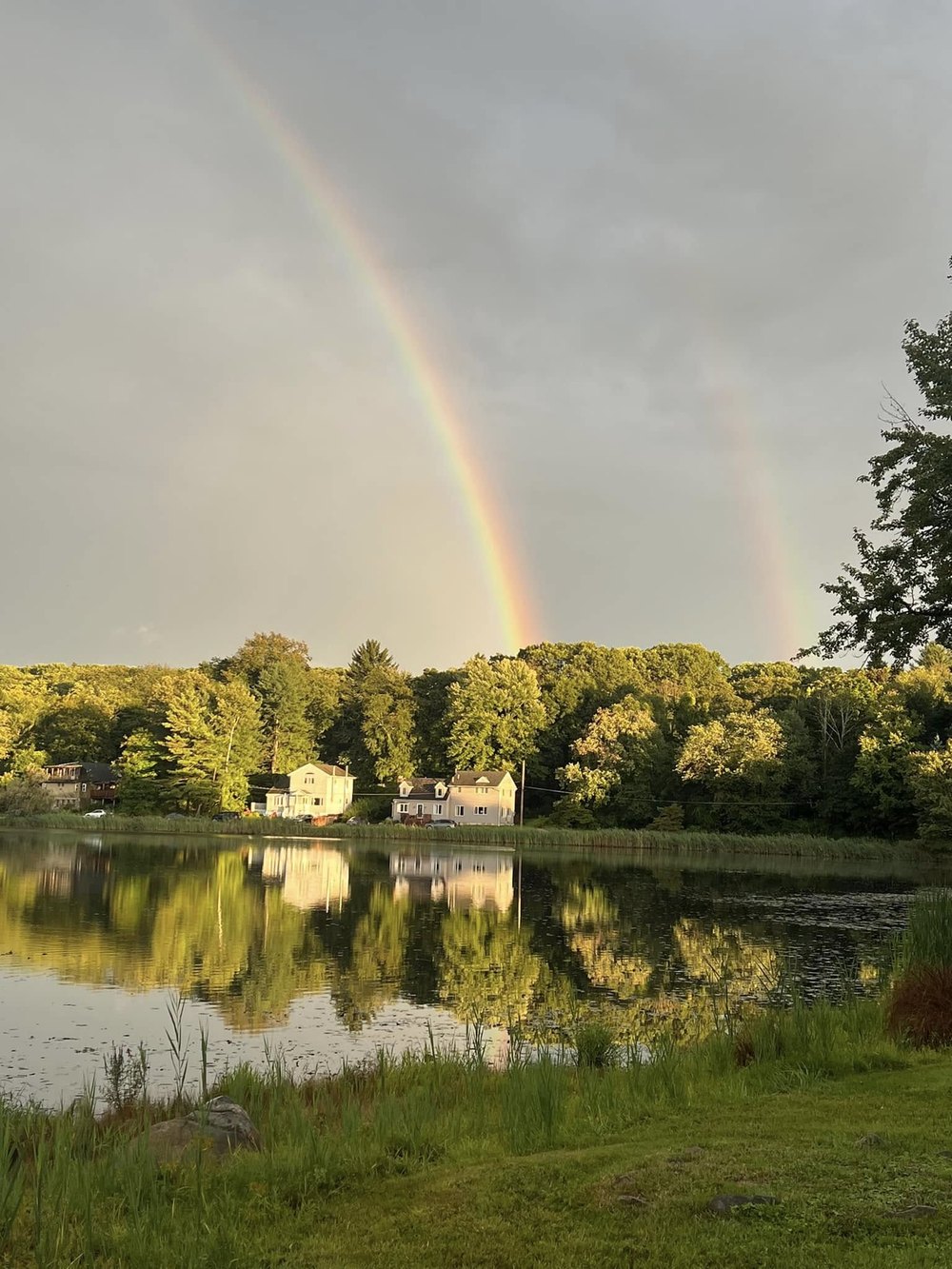 Double rainbow above Sparta Lake and the surrounding homes
