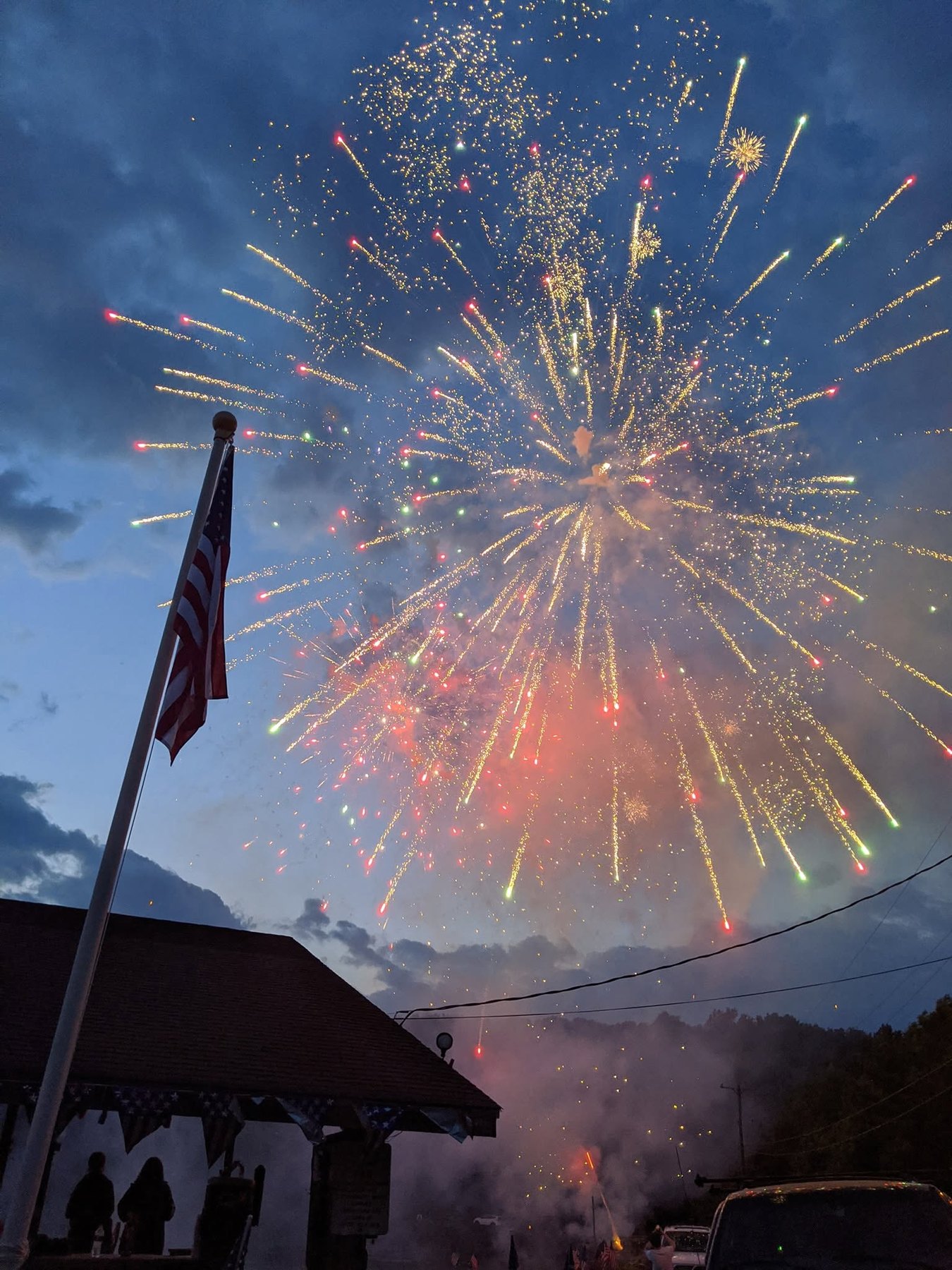 Fireworks above the Sparta Lake pavilion and American flag