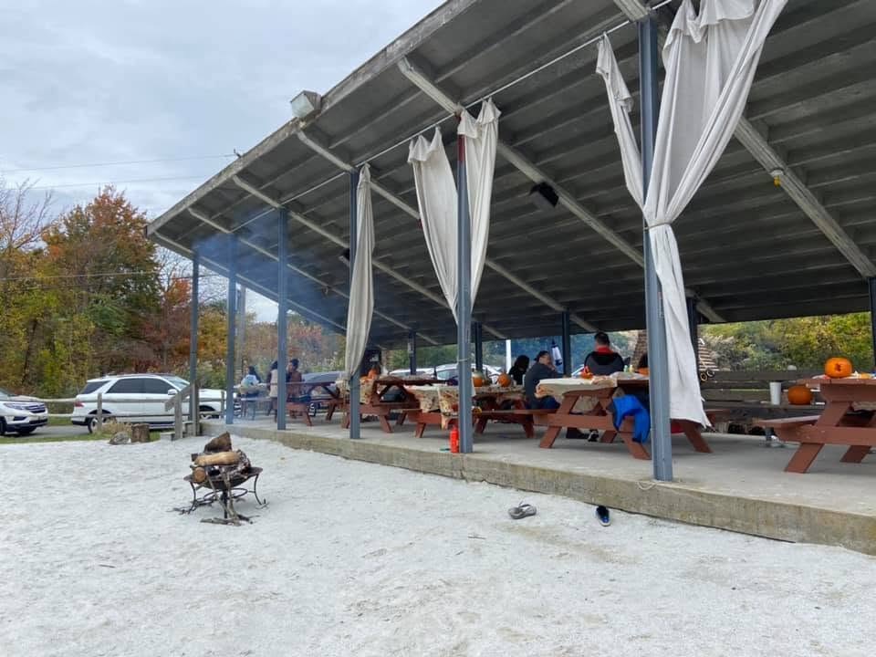 Neighbors gathering beneath the Sparta Lake pavilion